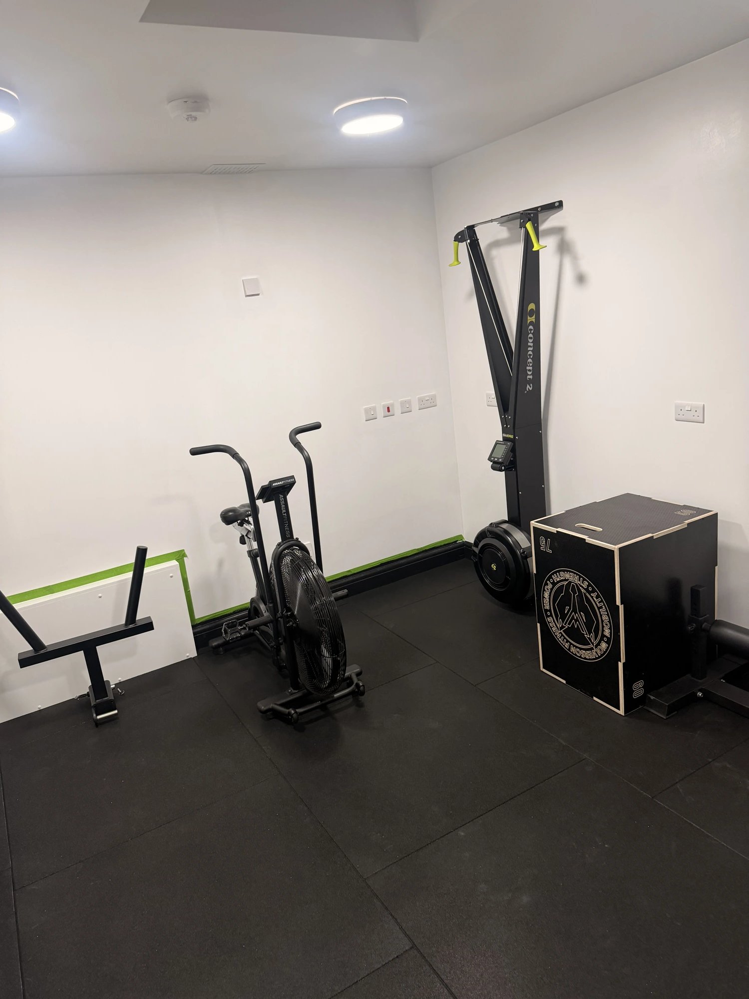 Concept2 rower, assault bike and plyo box in the conditioning area at OSHPerformance Northwood