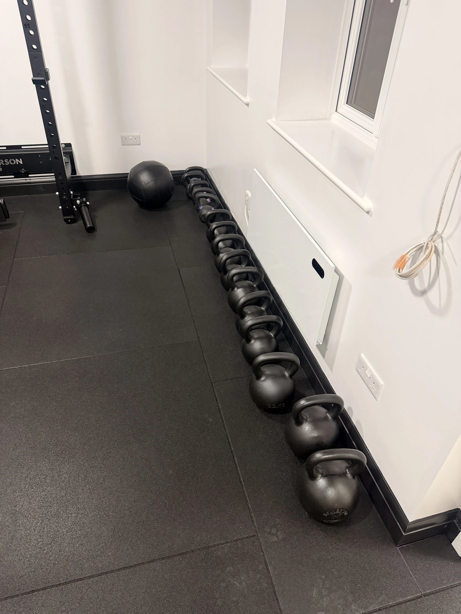 Kettlebell rack and medicine ball at OSHPerformance personal training gym Northwood